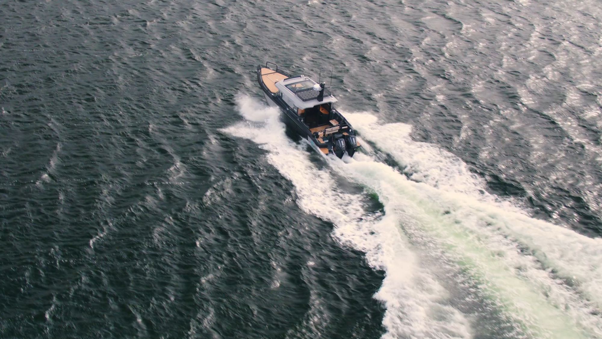 Boat breaking through water