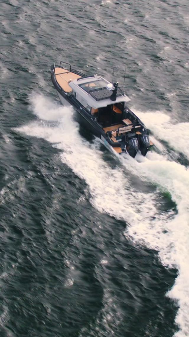 Boat breaking through water